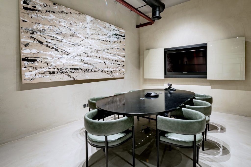 Professional workspace with boardroom setup for team presentations