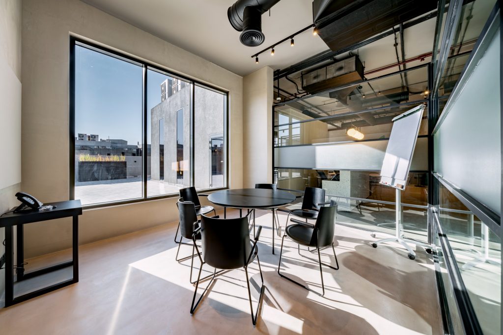 Shared Office Space in Riyadh Meeting room at R House with video conferencing tools and workspace setup