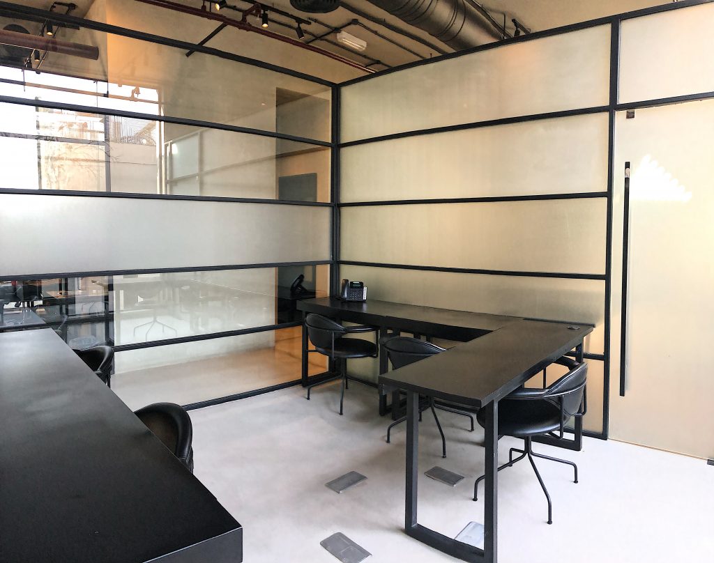 Professional workspace with boardroom setup for team presentations